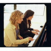 Vanessa and Carole play piano.  Photo by Jim Wright